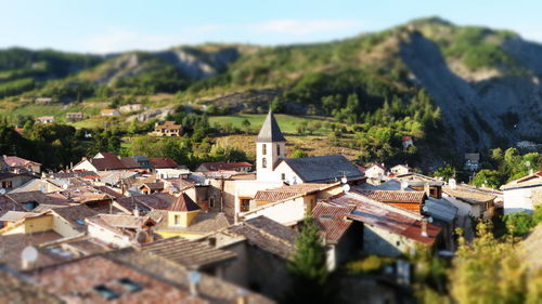 Buildings in town against mountain