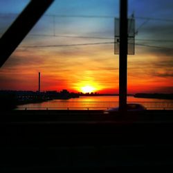 Silhouette of built structure at sunset