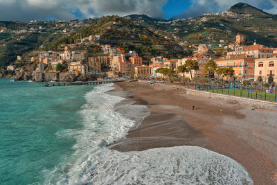 Amalfi coast, scenic view of beach by buildings in city