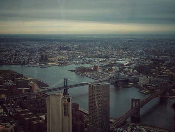 Cityscape against cloudy sky