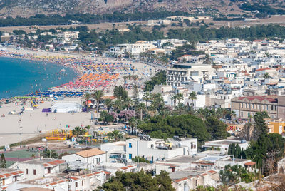 High angle view of townscape by sea