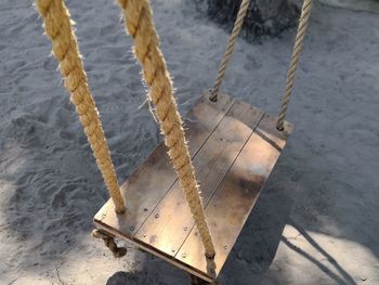 High angle view of rope tied on beach