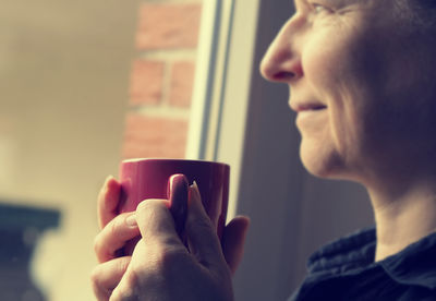 Close-up of woman holding coffee cup