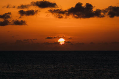 Scenic view of sea against romantic sky at sunset