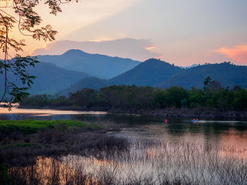 Scenic view of lake against sky during sunset