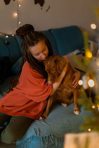 Portrait of young woman with dog