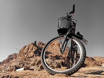 Bicycle parked on rock