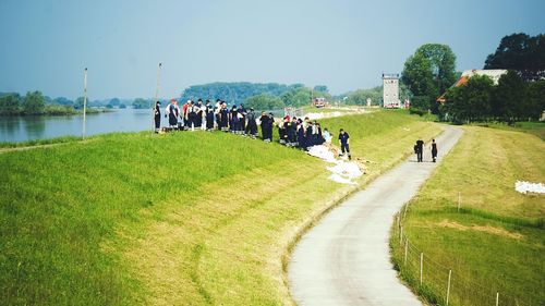 People on grassy landscape