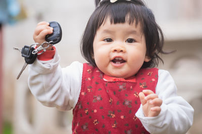 Portrait of cute girl playing outdoors