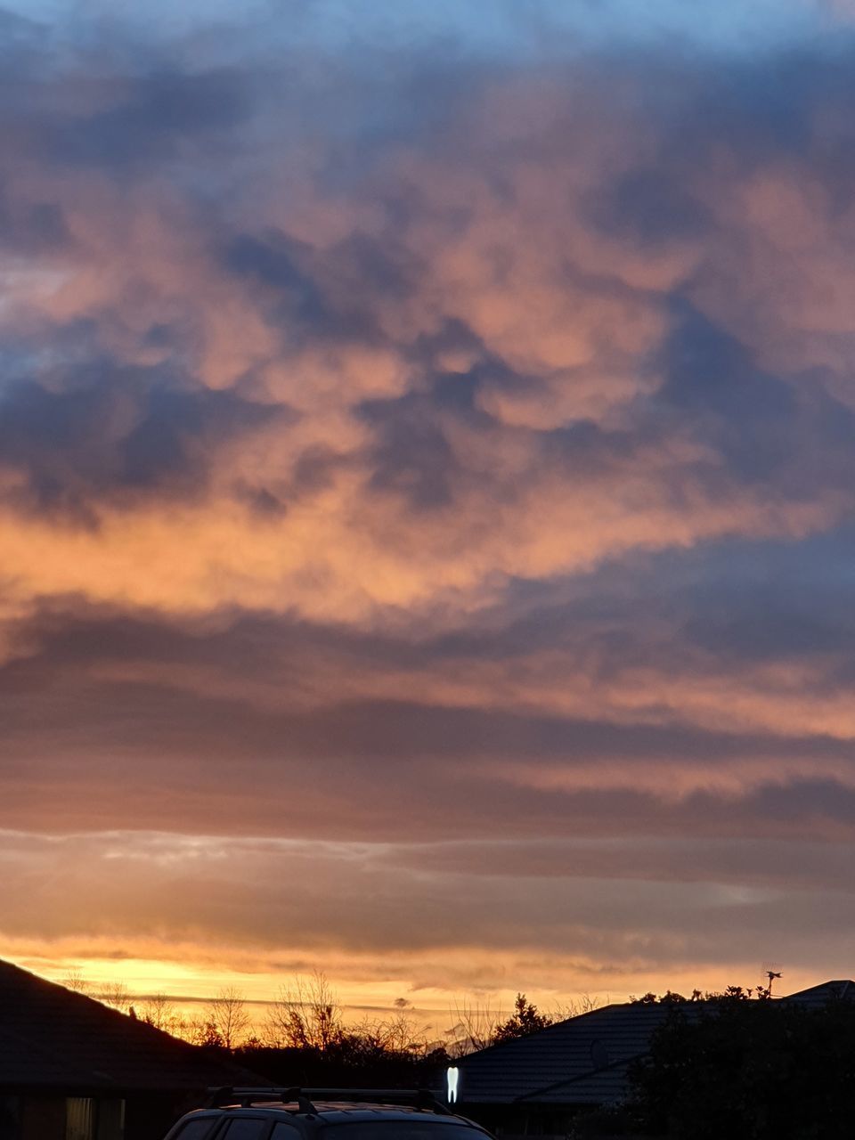 SCENIC VIEW OF SILHOUETTE MOUNTAIN AGAINST ORANGE SKY