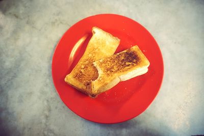 High angle view of heart shape bread on plate