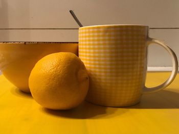 Close-up of yellow drink on table