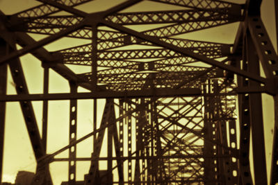 Low angle view of metal structure against sky