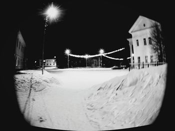 View of illuminated building at night during winter