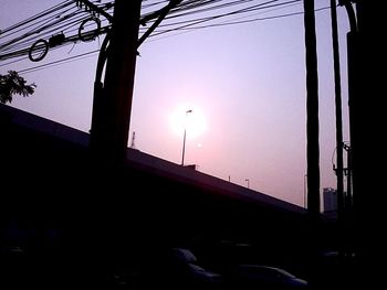 Low angle view of illuminated street light against sky