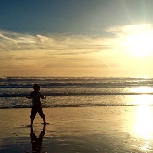 Silhouette of people on beach