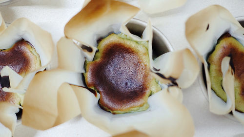 High angle view of mini matcha basque burnt cheese cake 