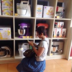 Woman holding ice cream in store