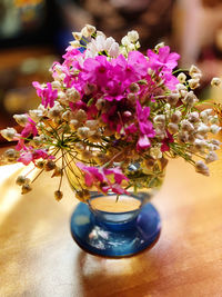 Close-up of purple flower vase on table