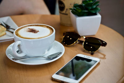 High angle view of coffee cup on table