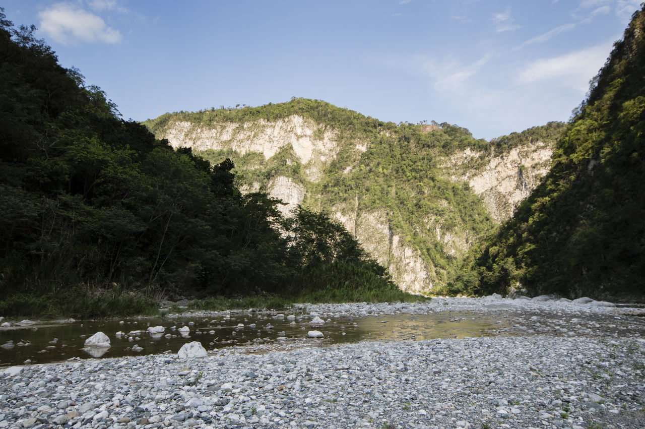 rock - object, nature, mountain, tranquility, day, beauty in nature, tranquil scene, water, scenics, sky, no people, outdoors, tree, landscape