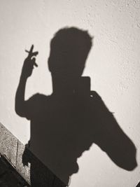 Shadow of man on wall