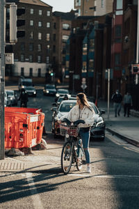 Man riding bicycle on city street
