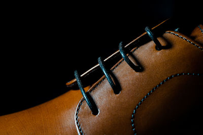 Close-up of leather over black background