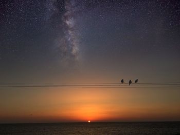 View of calm sea at sunset