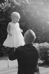 Rear view of couple standing on ground