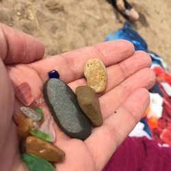 Cropped image of hand holding tattoo