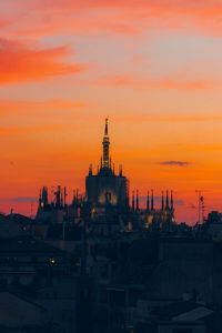 View of church in city during sunset