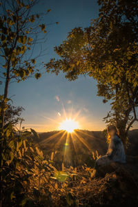 Scenic view of field against sky during sunset