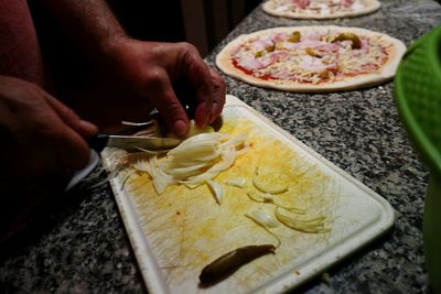 High angle view of man preparing food in kitchen