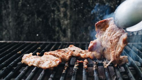 Close-up meat on barbecue grill