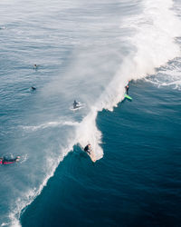 High angle view of people on sea