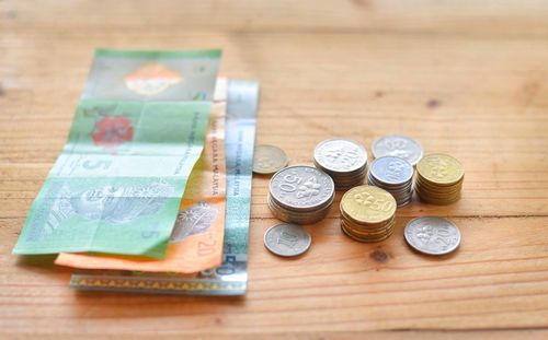 High angle view of coins on table