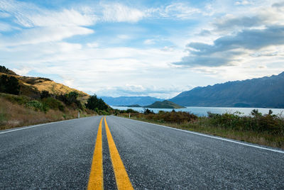 Surface level of empty road against sky