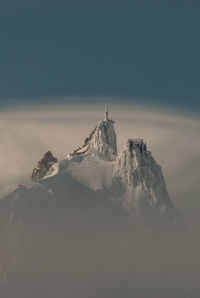 Scenic view of snowcapped mountain against sky