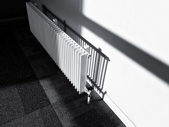 Close-up of metal radiator against wall