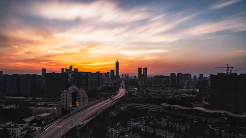 High angle view of buildings against sky during sunset