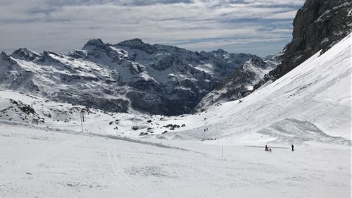 Scenic view of snowcapped mountains against sky