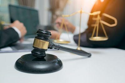 Close-up of clock on table