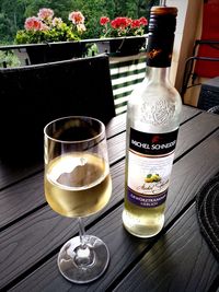 Glass of bottles on table