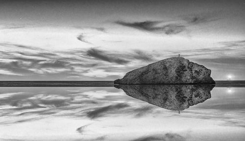 Digital composite image of lake against sky