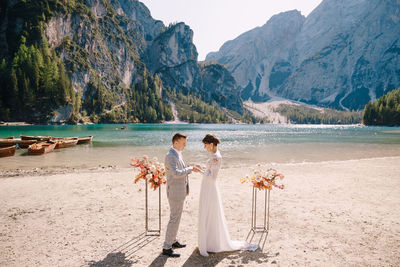 Couple kissing on mountain by mountains