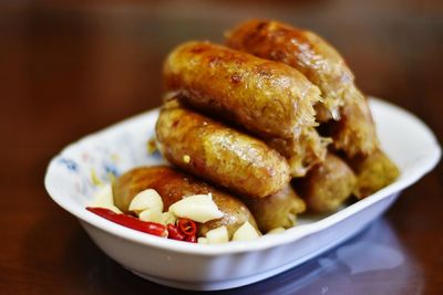 Close-up of food with garlic and chili pepper served in plate