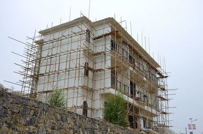 Low angle view of old building against clear sky