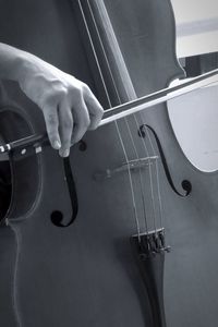 Cropped hand playing cello