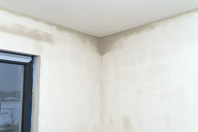 Freshly laid gypsum on the walls and ceiling of a newly built detached house.